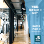 Season 5 Episode 18: Values: From Walls to Halls, shows a hallway of an office building with hardwood floors and long glass pane conference room on the left side.