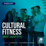 Season 7 Episode 33: Cultural Fitness (Not Just Fit), image of office group of people working at a clear glass board with post-its on it on a blue background filter.
